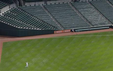 Baltimore Orioles right fielder Delmon Young fields a single by Chicago White Sox's Avisail Garcia in the second inning of a baseball game, Wednesday, April 29, 2015, in Baltimore. The game was played in an empty Oriole Park at Camden Yards amid unrest in Baltimore over the death of Freddie Gray at the hands of police.