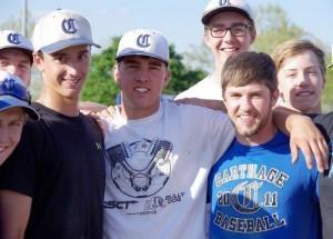 No longer facing the prospect of being expelled, third baseman Sawyer Shepherd, center, made his first stop back at school to visit his teammates. (Photo: John Hacker/Carthage Press) 