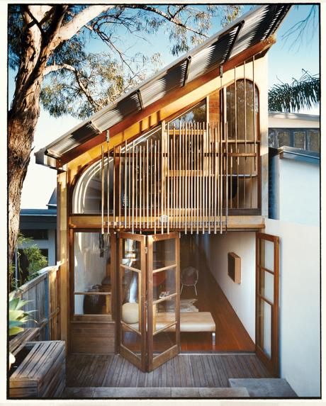 Façade with custom cedar windows and wooden dowels