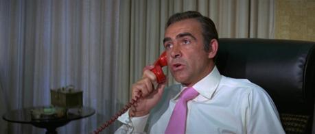 Bond Style – Cream Linen Suit in Vegas (Diamonds are Forever) I kind of get how this machine would work. But why does it seem to change Bond's voice even when we're in the same room as him?