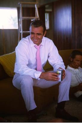 Bond Style – Cream Linen Suit in Vegas (Diamonds are Forever) Connery enjoys a refreshing Gatorade between takes.