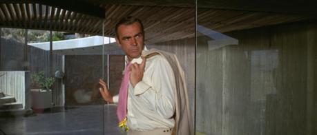 Bond Style – Cream Linen Suit in Vegas (Diamonds are Forever) Connery is mystified: why did he need to wear a suit and tie if he was just going to take off the jacket for most of the scene anyway?