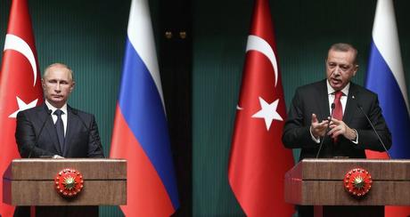 Turkish President Recep Tayyip Erdogan (R) and Russian President Vladimir Putin (L) hold a joint press conference at Turkey's Presidential Palace in Ankara