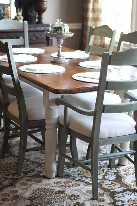 GORGEOUS chairs.  I was already planning natural linen seat covers for mine, and doing the top of the black table wood like this.  Maybe with blue chairs!