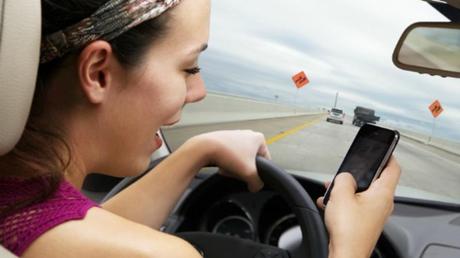 A driver browsing social networks while at the wheel.