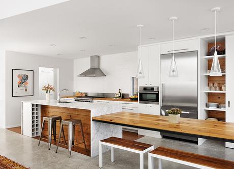 Modern Texan addition and renovation with marble island and integrated wood in the kitchen