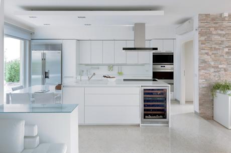 The sleek, modern design of Sub-Zero and Wolf products work seamlessly with this all-white kitchen.
