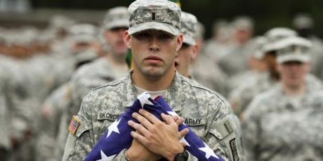 soldier hugs flag
