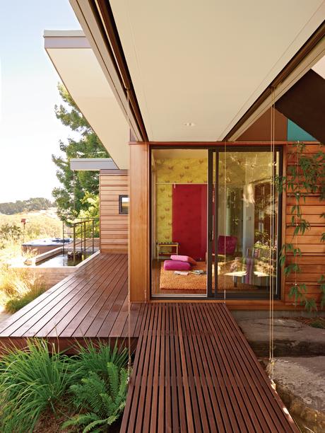 Outdoor slatted walkway with 3form sliding wall panel