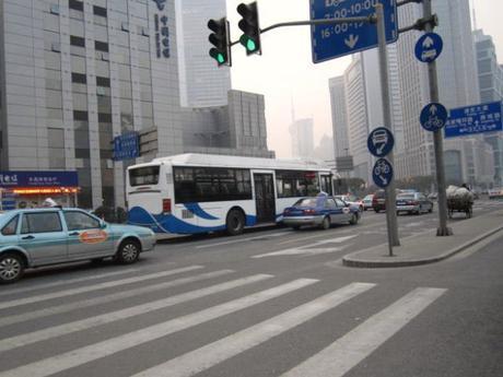 VW Santana taxis compete with buses for road space in Shanghai.