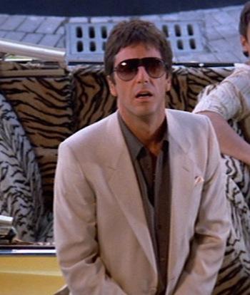 Scarface: Tony’s Tan Suit and Cadillac Al Pacino stands next to a bright '63 Caddy convertible as Tony Montana in Scarface (1983).