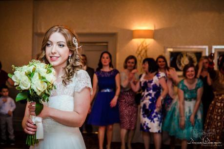 Bride prepares to toss bouquet