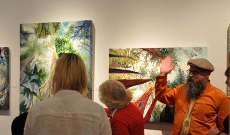 Art enthusiasts viewing paintings by Portland, Oregon artist Cedar Lee at Attic Gallery