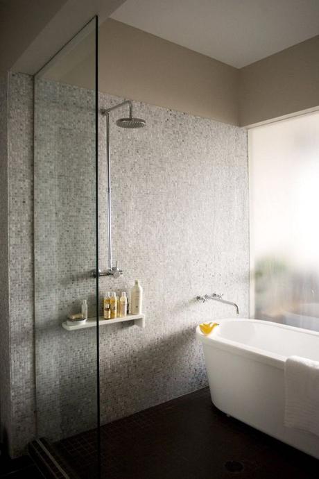 This freestanding tub is within a wet-room/large shower area.  Via #Remodelista.
