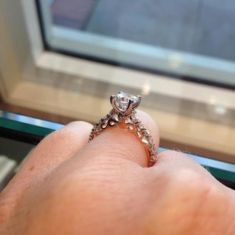 Solitaire engagement ring with rose gold side