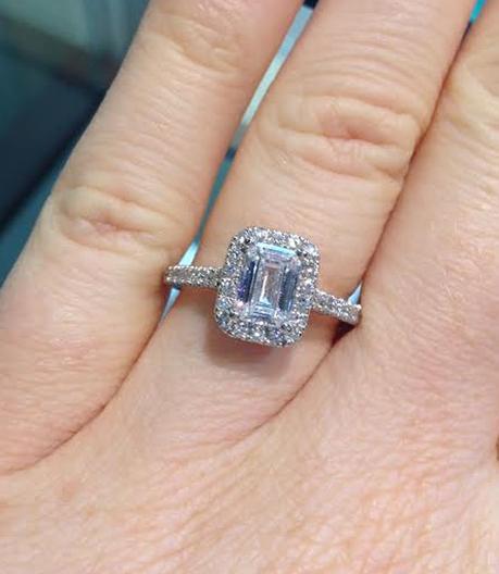 Emerald cut halo engagement ring