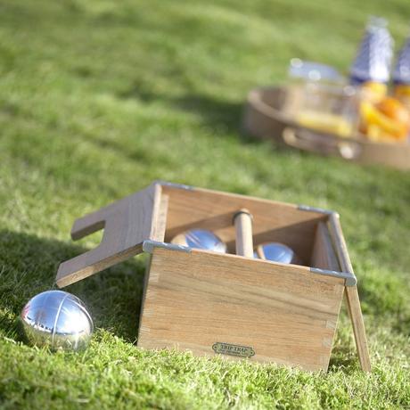 Classic lawn game with chrome balls and teak box