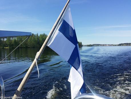Finnish flag while cruising Lake Saimaa, looking for Saimaa ringed seals in Savonlinna, Finland.