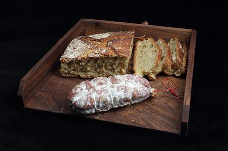 Sophisticated walnut wood bread board with leather tie