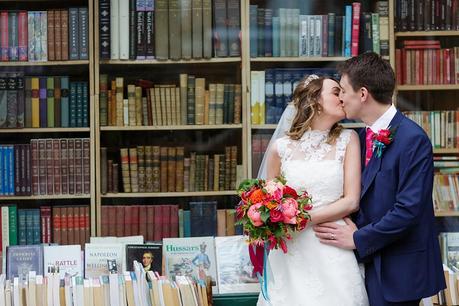 York Wedding Photography burde in front of book shop with colourful bouquet