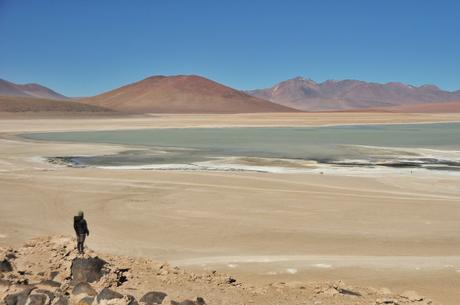 Admiring one of the funny colored lakes: colored due to the minerals.