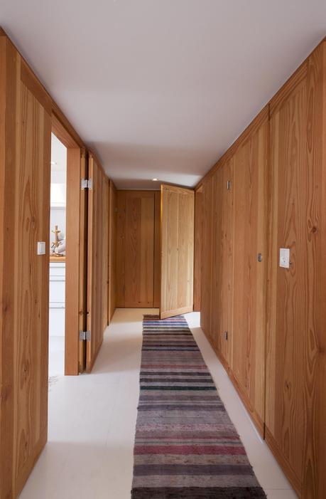 Modern hallway with a striped rug