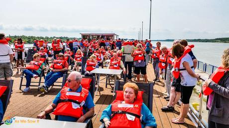 Passengers wearing life jackets on Viking Bragi sun deck