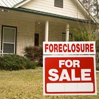 What was the real reason that our house went into foreclosure immediately after my release from jail?