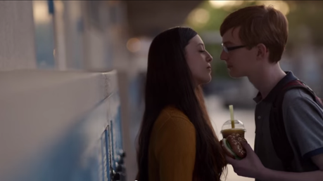 If this were not fake, it would be a miracle of commercial footage photography for the Boy who has met this Girl to be holding Panera product so perfectly right there by her chest. A miracle.