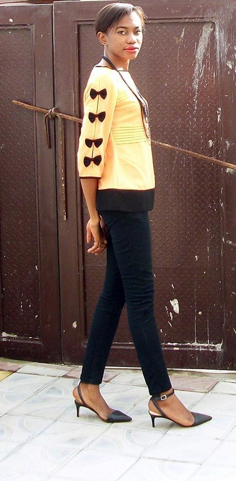 Black bows on orange sleeves
