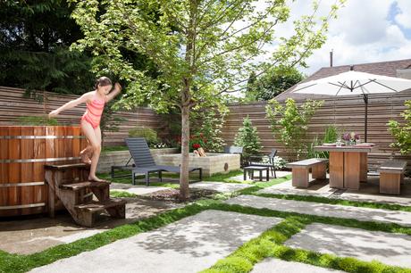 Custom backyard with a soaking tub and fire pit in Portland