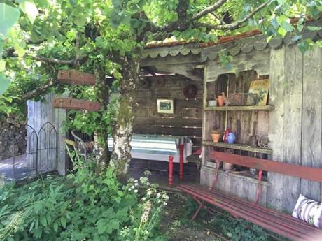 a place to sit and eat outdoors protected from the elements