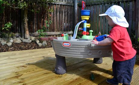 child playing with Little Tikes Anchors Away Pirate Ship 