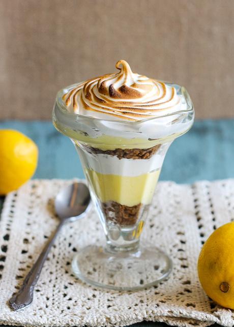 These Lemon Meringue Pie Parfaits are a no-bake dessert that will be your new summer favorite! Lemon curd, graham cracker crumbs, and meringue makes the best individual treats.
