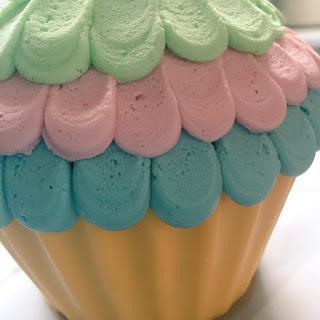 Giant Cupcake Cake with Rainbow Frosting