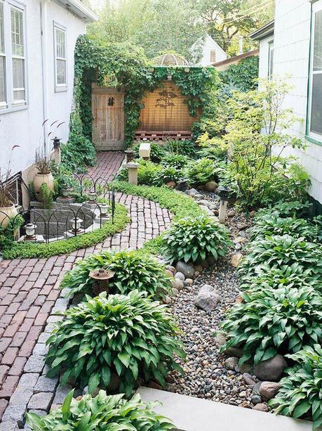 side yard idea - the curve of the path adds interest and takes the eye around the garden, not just straight down.