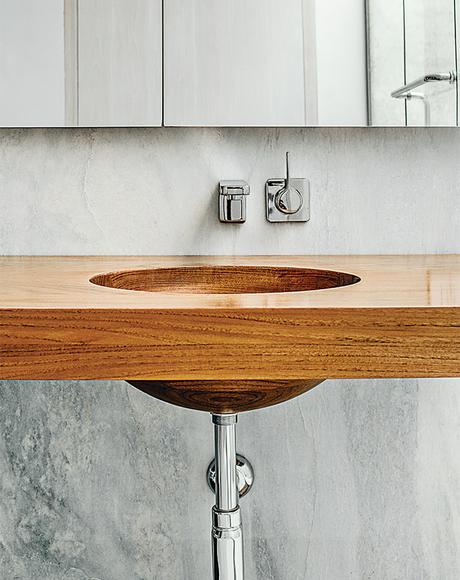 Modern Connecticut summer home renovation with custom teak vanity in the master bathroom