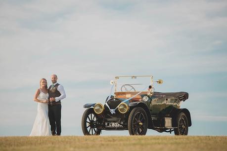 Bride & groom & vintage car