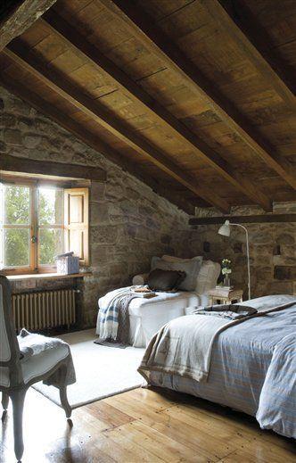 stone and wood attic bedroom
