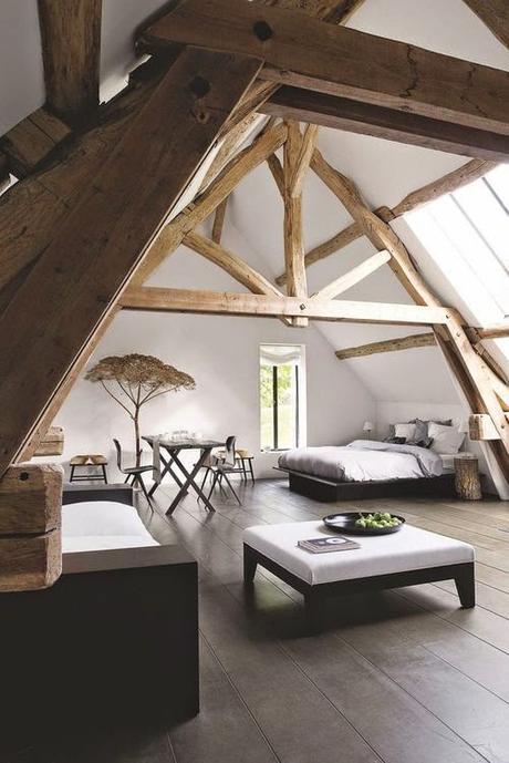 hand carved wooden beams in attic room