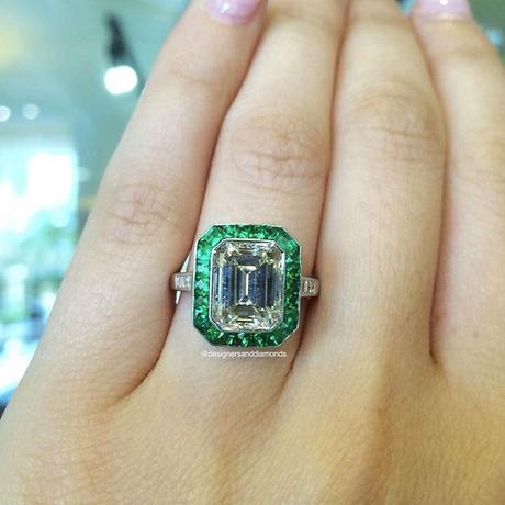 Platinum diamond and emerald emerald cut halo engagement ring