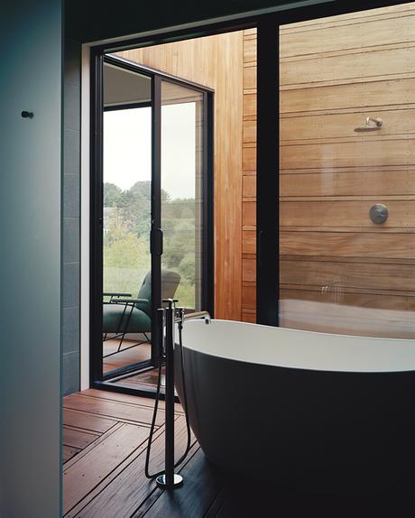 Master suite bathroom that leads to an open-air shower