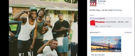 Tyrone Harris with his gangbanger buddies. Those are gang signs they are flashing, but I am not sure which gang.