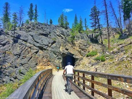 As part of the Myra Canyon scenic cycle route in Kelowna, cyclists go through 2 former railway tunnels.