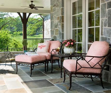 coral colored seat cushions on slate porch