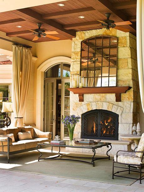 outdoor entertainment area with stone fireplace