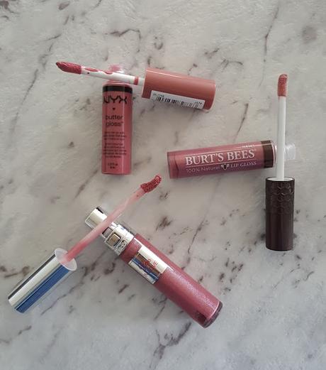 Left to right: NYX Butter Gloss Angel Food Cake, Burt's Bees Lip Gloss Nearly Dusk, Lancome Gloss in Love 351