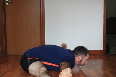 Upavistakonasana: put legs at about 90 degrees relative to each other, and then lean forward with a flat back placing the stomach, chest, and chin on the floor (in that order.)