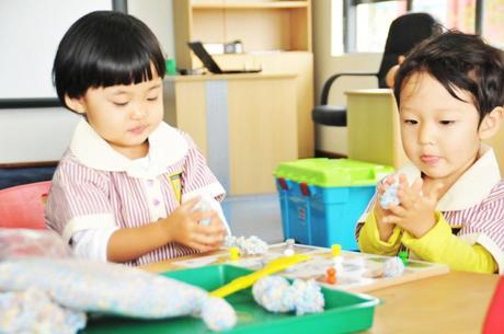 Having fun requires serious concentration! Girls at GEMS Cambridge International School Kampala