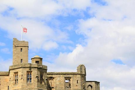 Warkworth Castle under blue skies